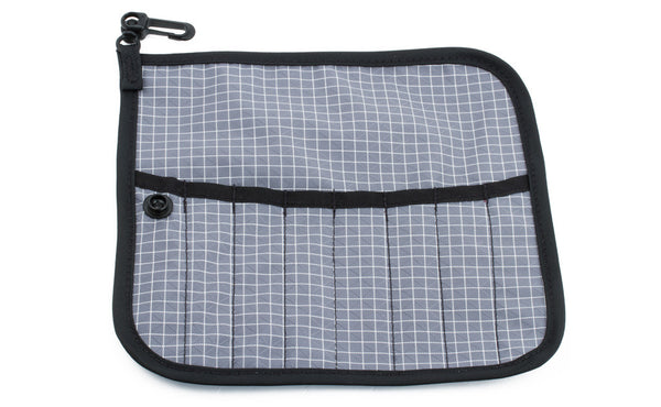 The front of a Tool Pen Wrap in Northwest Sky (light grey with white grid) 200 Halcyon.